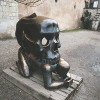 Man and Skull statue...